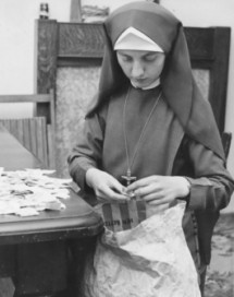 Sister Lynne sorting stamps